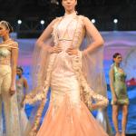 A long fleared gown with a cap shrug