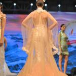 A long fleared gown with a cap shrug